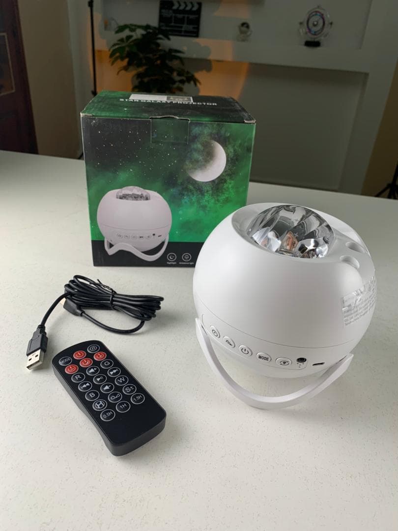 Projecteur d’aurores et Haut Parleur Bluetooth avec 15 modes d’éclairage – جهاز عرض نجوم ومكبر صوت — صورة حقيقية 8