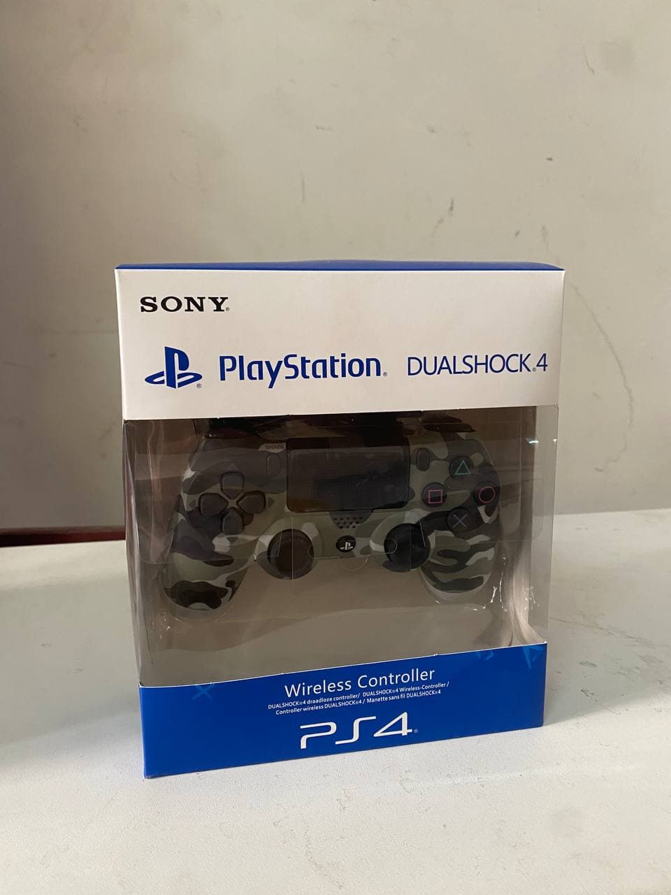 SONY DualShock Manette PS4 Sans Fil, Batterie Rechargeable (High Copy) – Gris Camouflage — صورة حقيقية 6